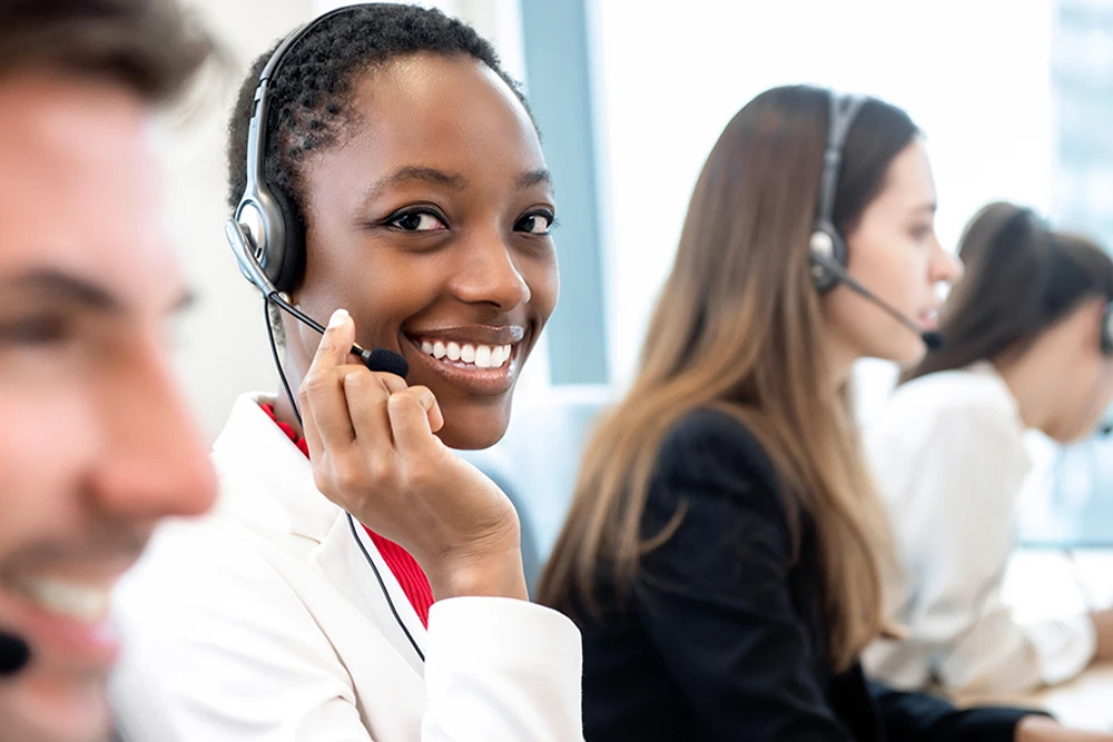 african american woman using a phone headset in workplace
